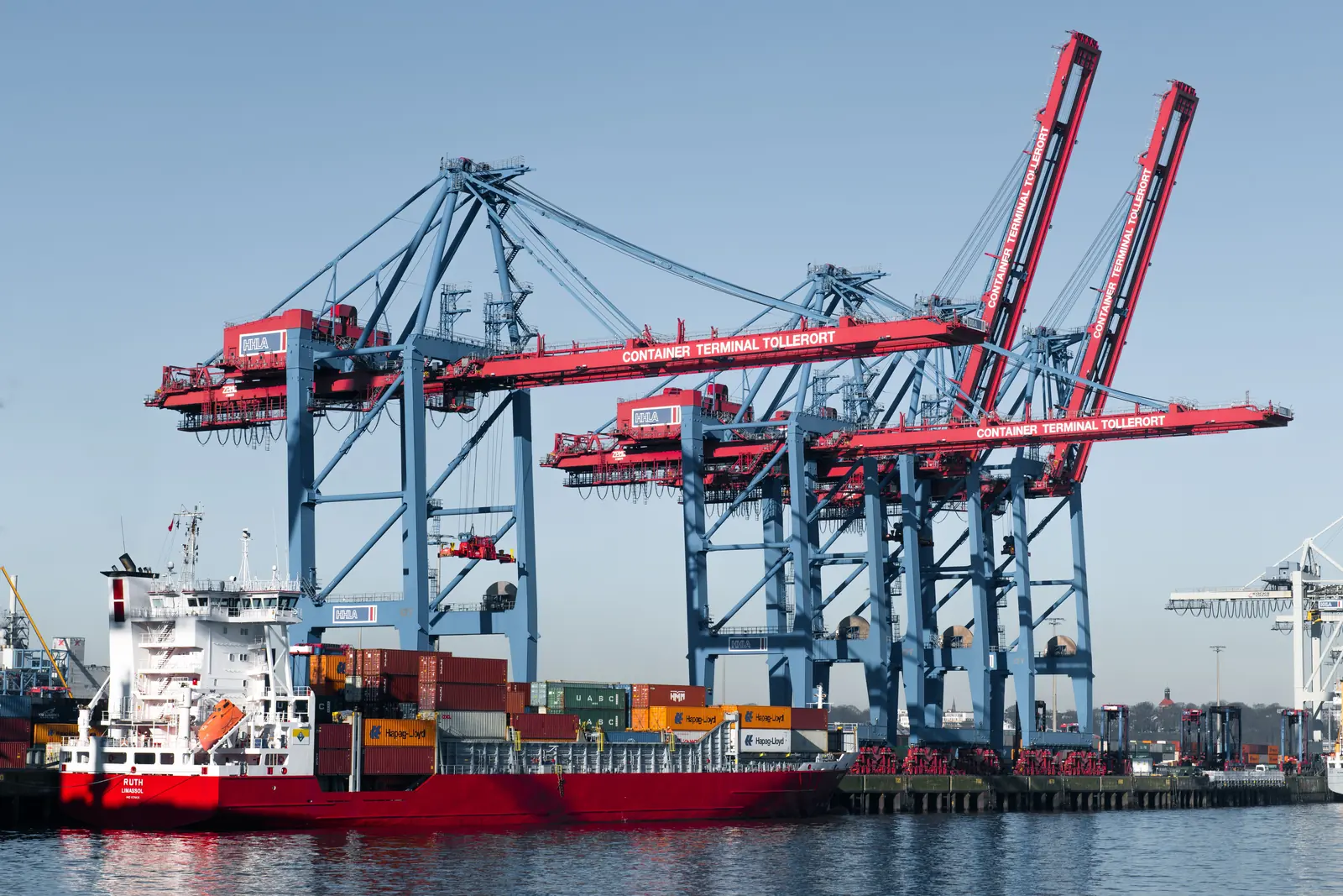 Gantry cranes loading a container vessel at a marine terminal